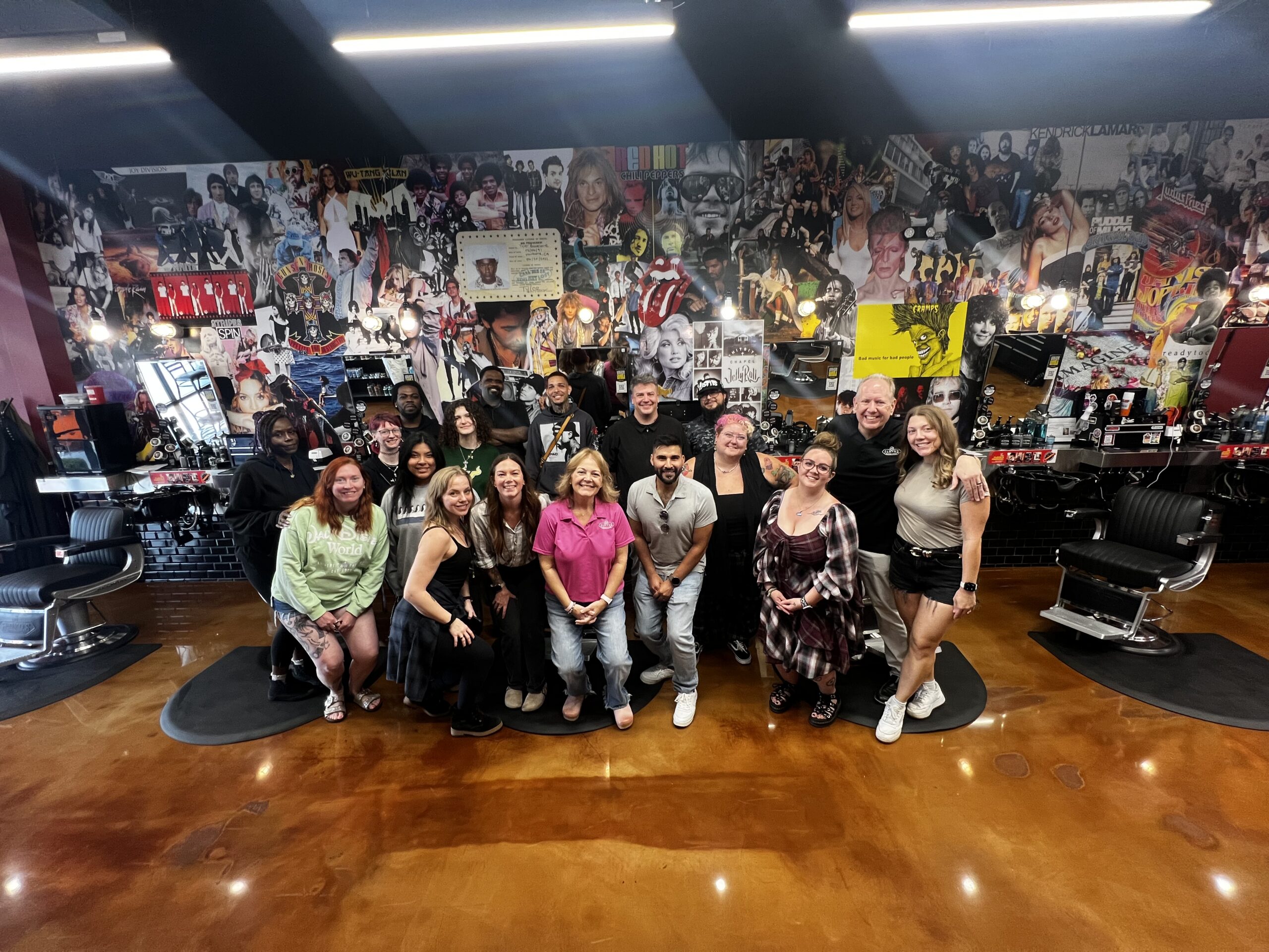 Smiling team at a Floyd's Barbershop shop location